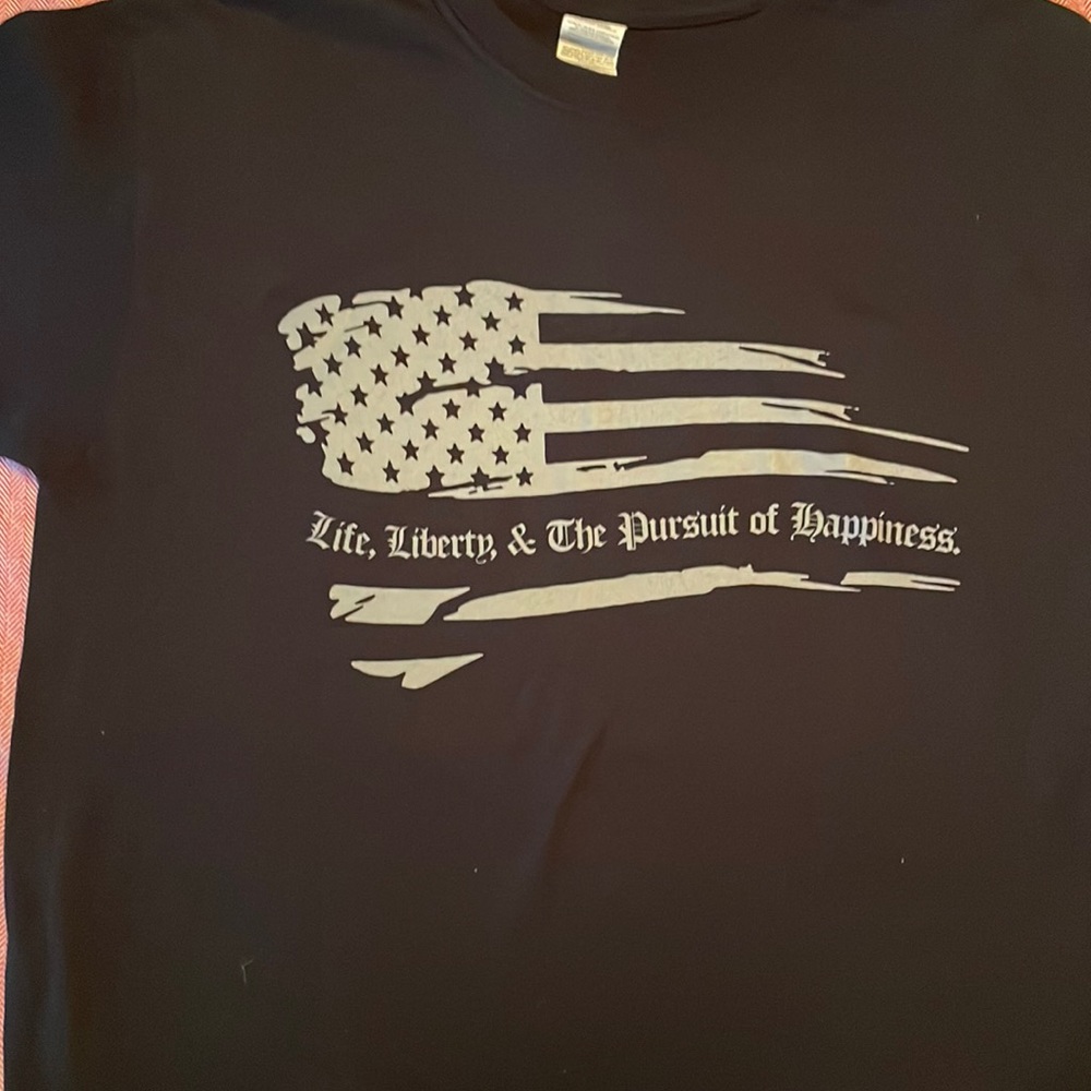 Black short sleeve T-shirt.
